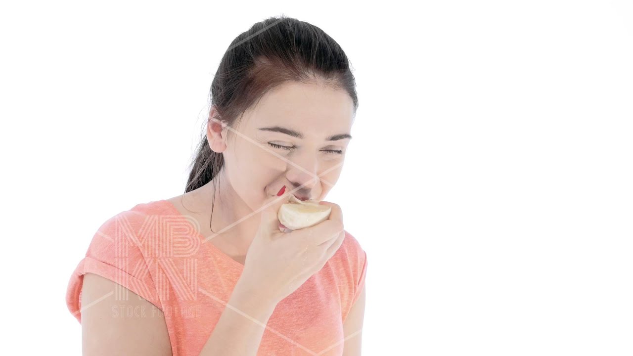 Girl Tries a Slice of Lemon