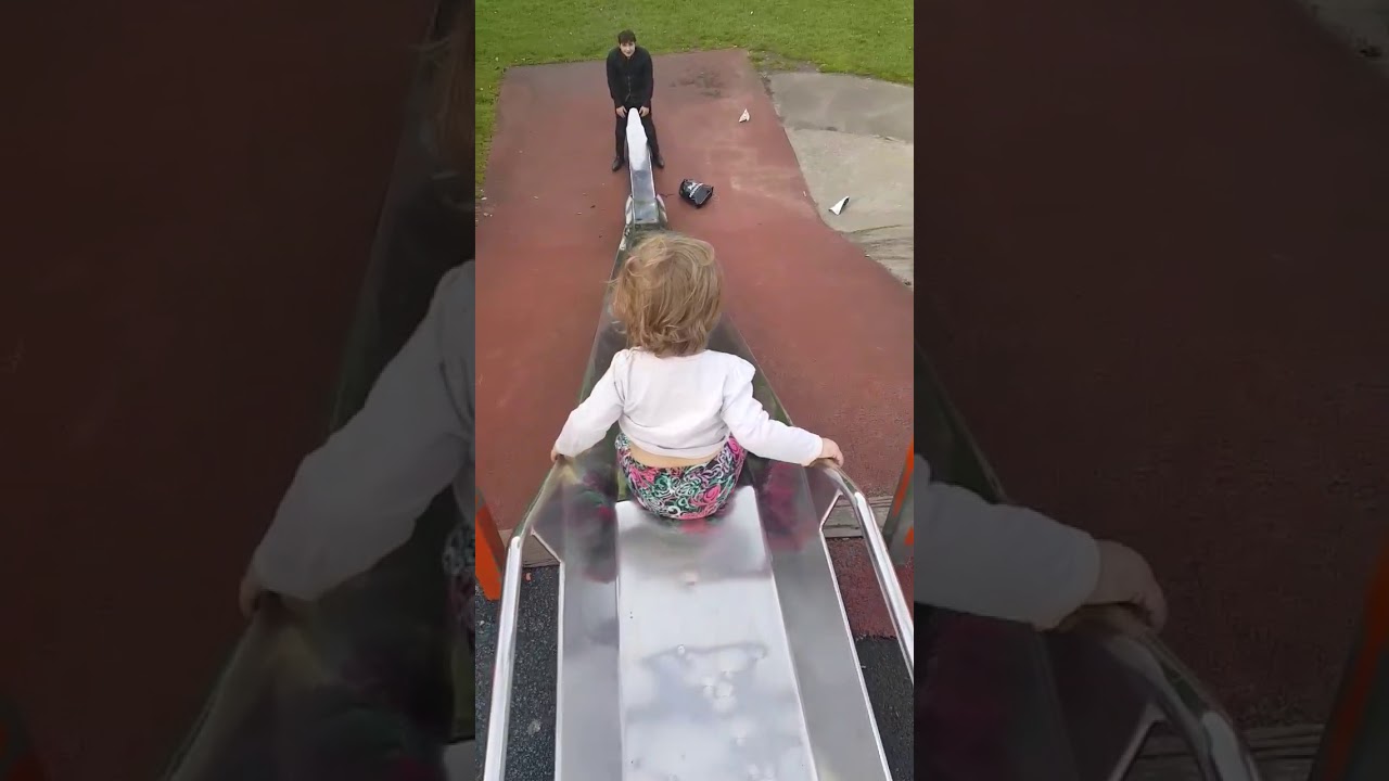 Kid sliding down the slide faceplants at the end | CONTENTbible