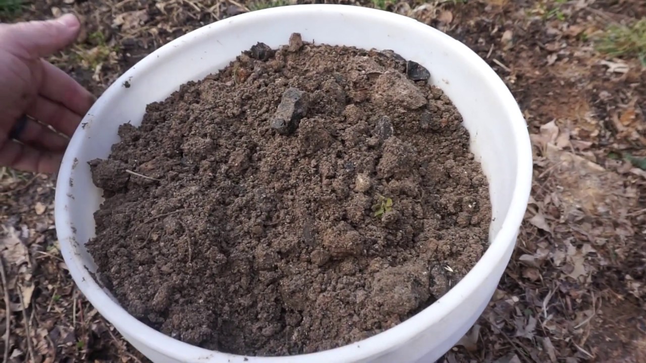 Adding wood ashes to your winter compost.