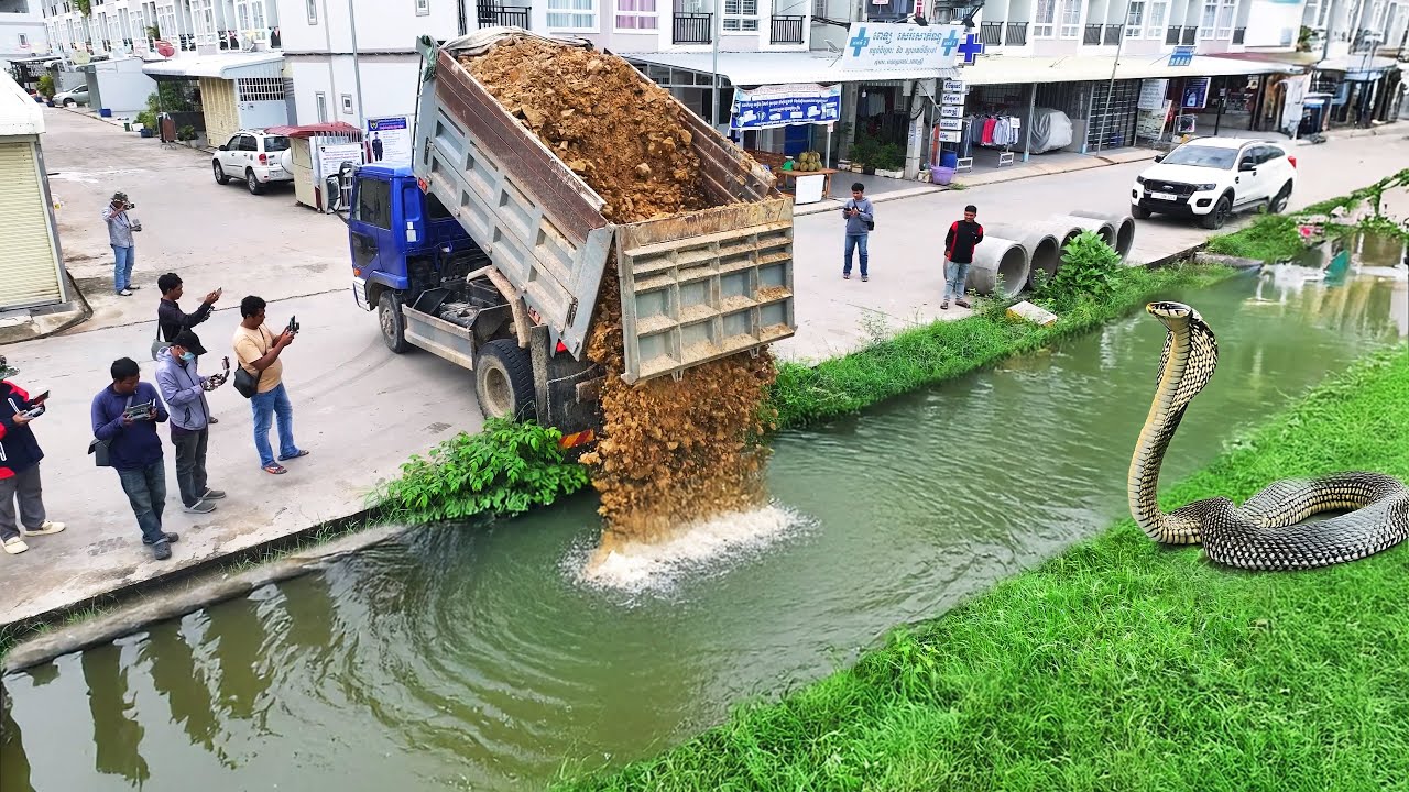 Interesting project !! Pouring soil into the canal to prepare the drainage system using Dozer D-31-P