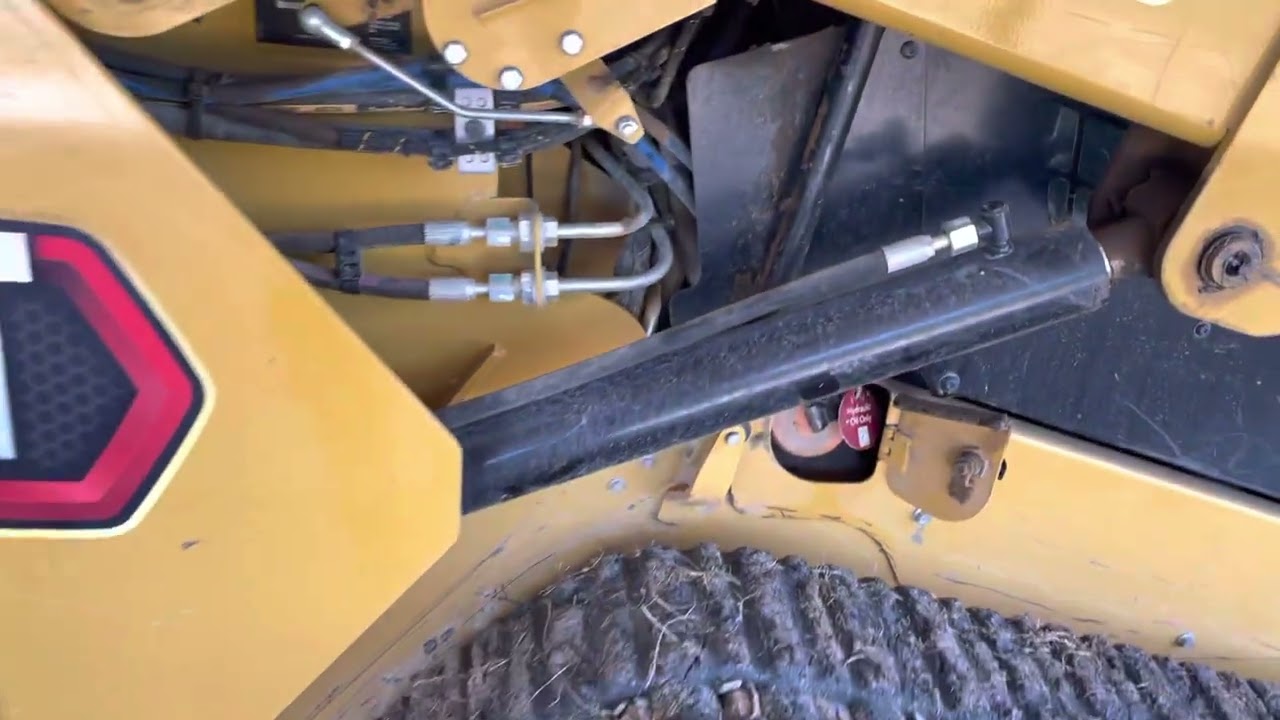 CAT 259D3 Hydraulic Fluid Drain if Overfilled