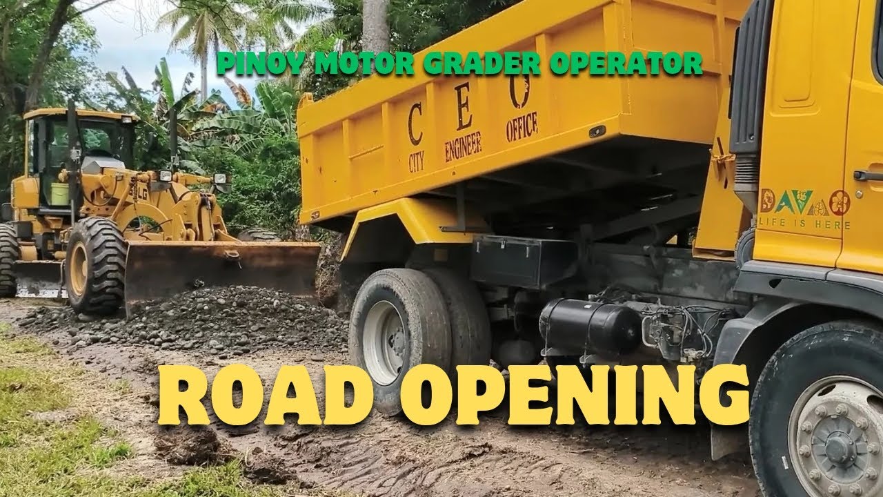 ROAD OPENING IN MAHAYAG, DAVAO CITY, PHILIPPINES. OPERATING HEAVY EQUIPMENTS. 