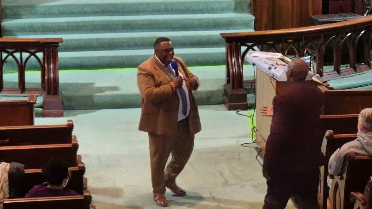 Pastor Hudson singing while doing the Invitation 