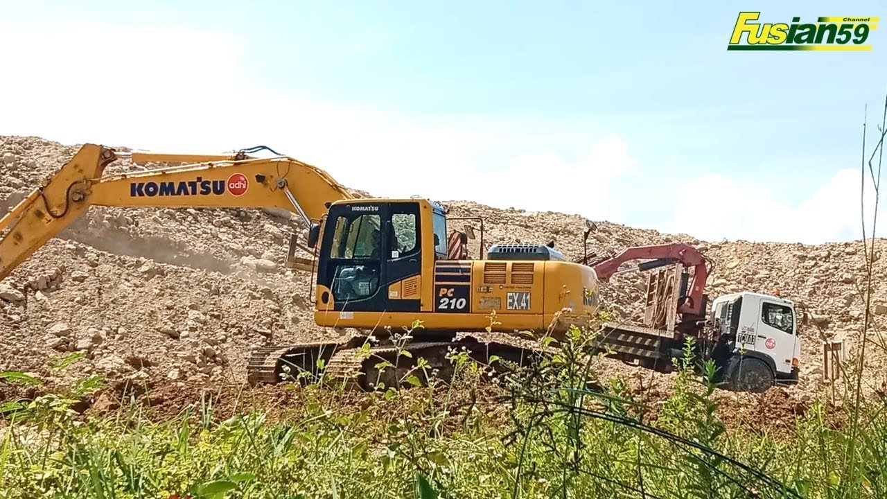 Komatsu PC210 Excavator for Road Reconstruction and Material Access Work