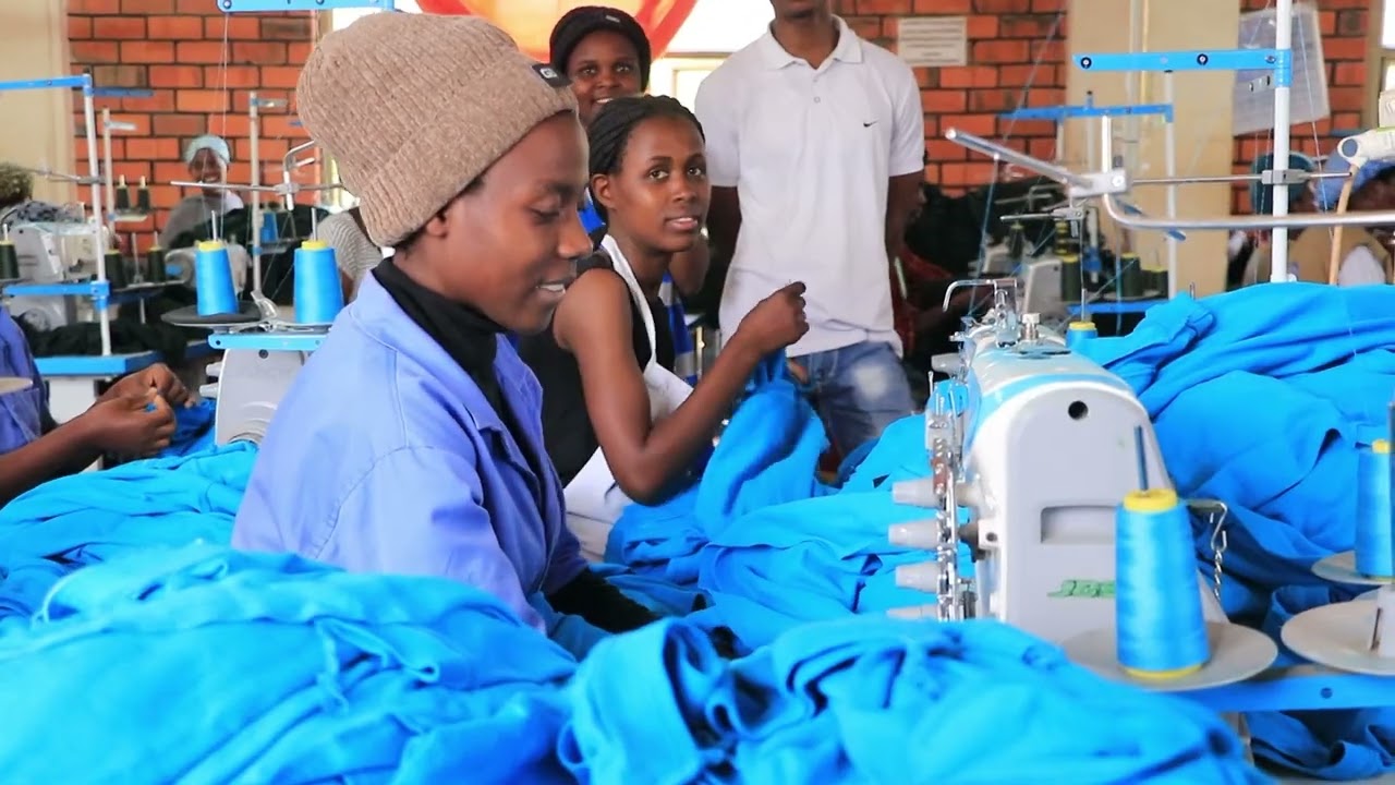 STUDENTS FROM ESTHER'S AID SCHOOL OF FASHION & DESIGN AT THE TEXTILE INDUSTRY IN RWANDA