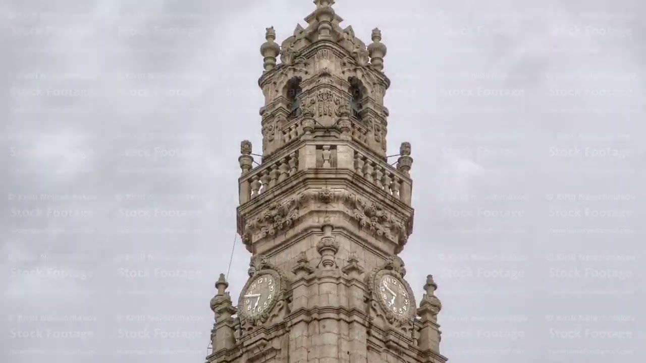 Bell tower of the Clerigos Church in cloudy blue sky background timelapse