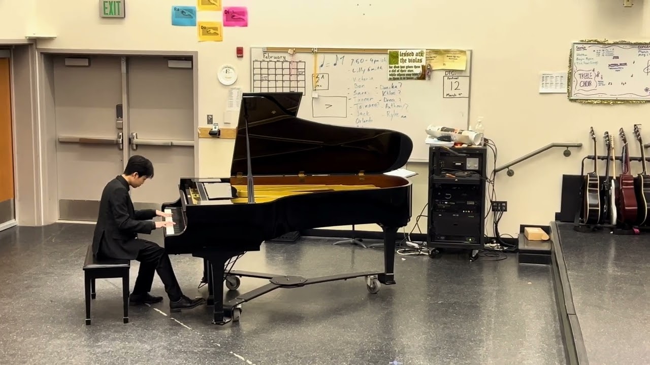 KhaiAn represents his school in piano for competition 