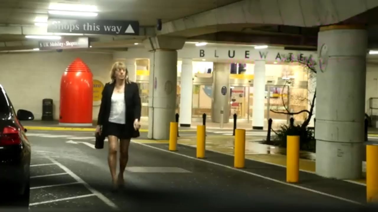 Bag Drop Fun in a Miniskirt and Stilettos