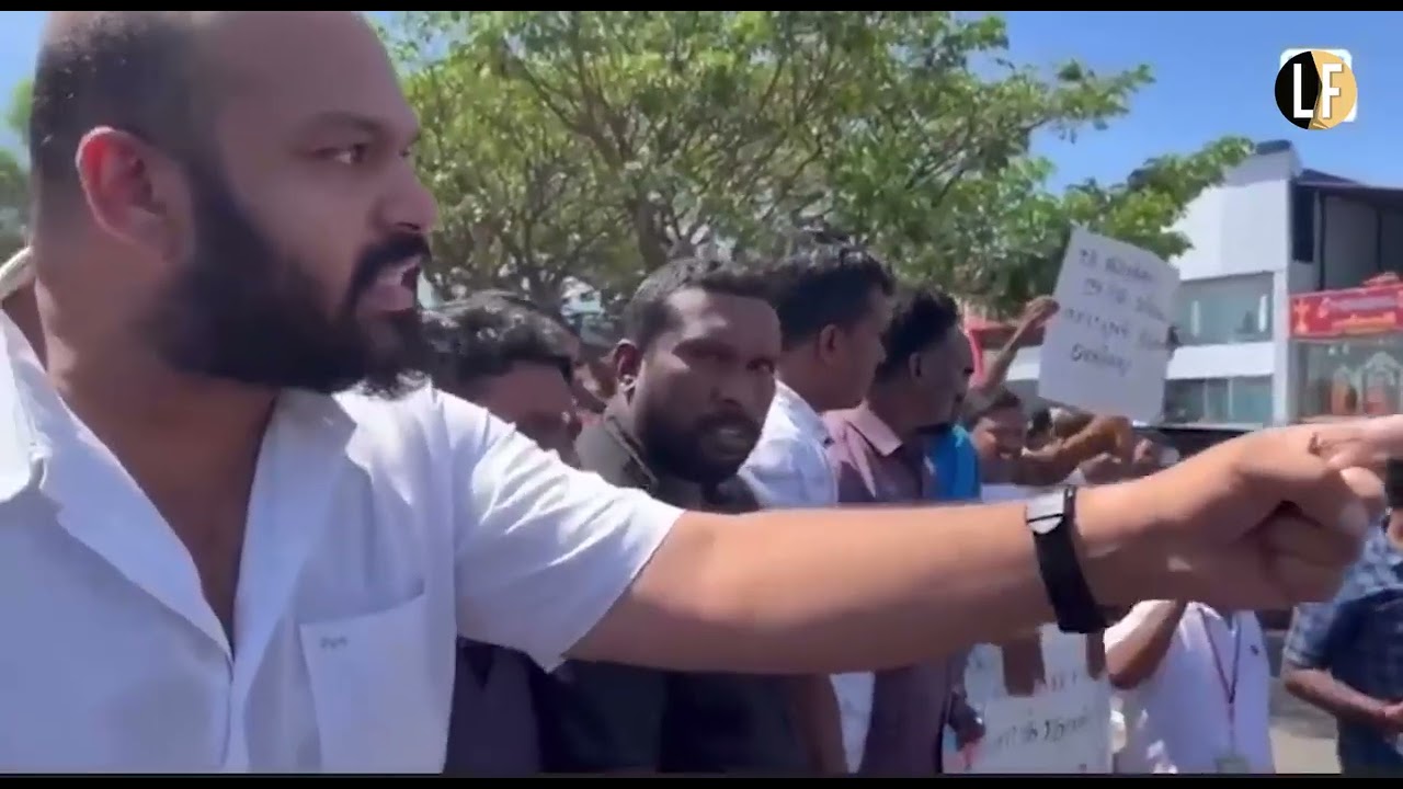 MP Shanakiyan berates police caught red handed mingling with journalists to covertly film protesters