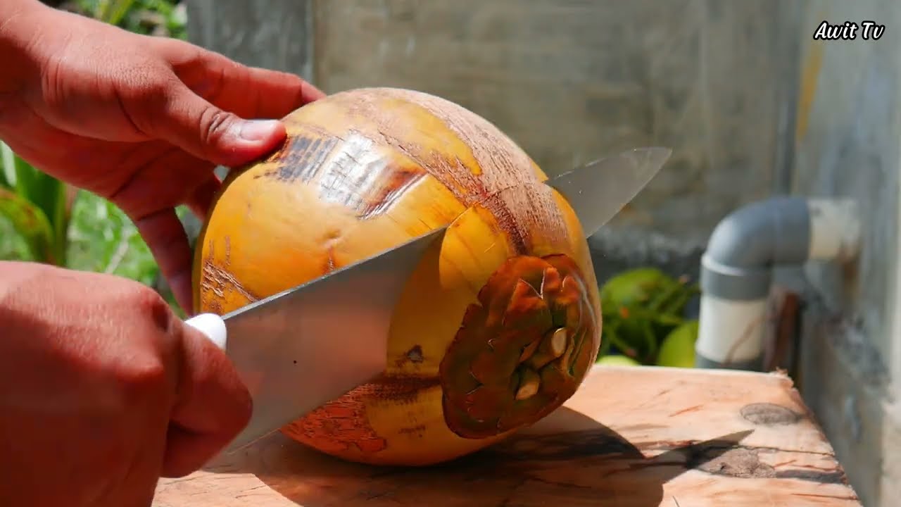 Amazing hand agility in cutting coconut