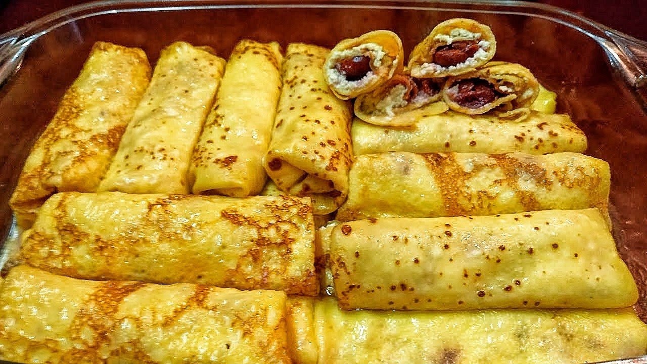 Млинці з сиром та вишнею , засмажені у духовкі. Просто смакота.
