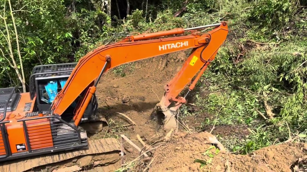 Breaking Ground Excavator on a Steep Woodland Hill