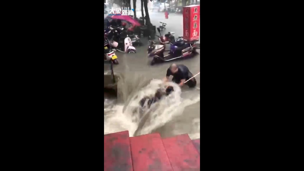 Woman saved in rapid water in China's Zhengzhou amid torrential rains
