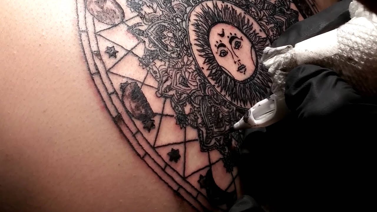 Tattooing a Sun & Moon Phases Mandala - Black Ink by Humo.