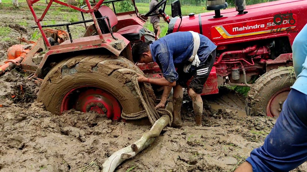 How to get tractor out of mud/This tractor stuck for 4 hours/tractor mud rescue/will come out or not