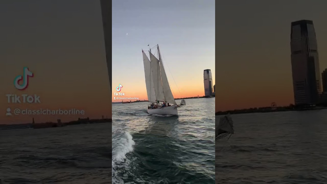 Cruising by Schooner Adirondack at sunset in New York Harbor