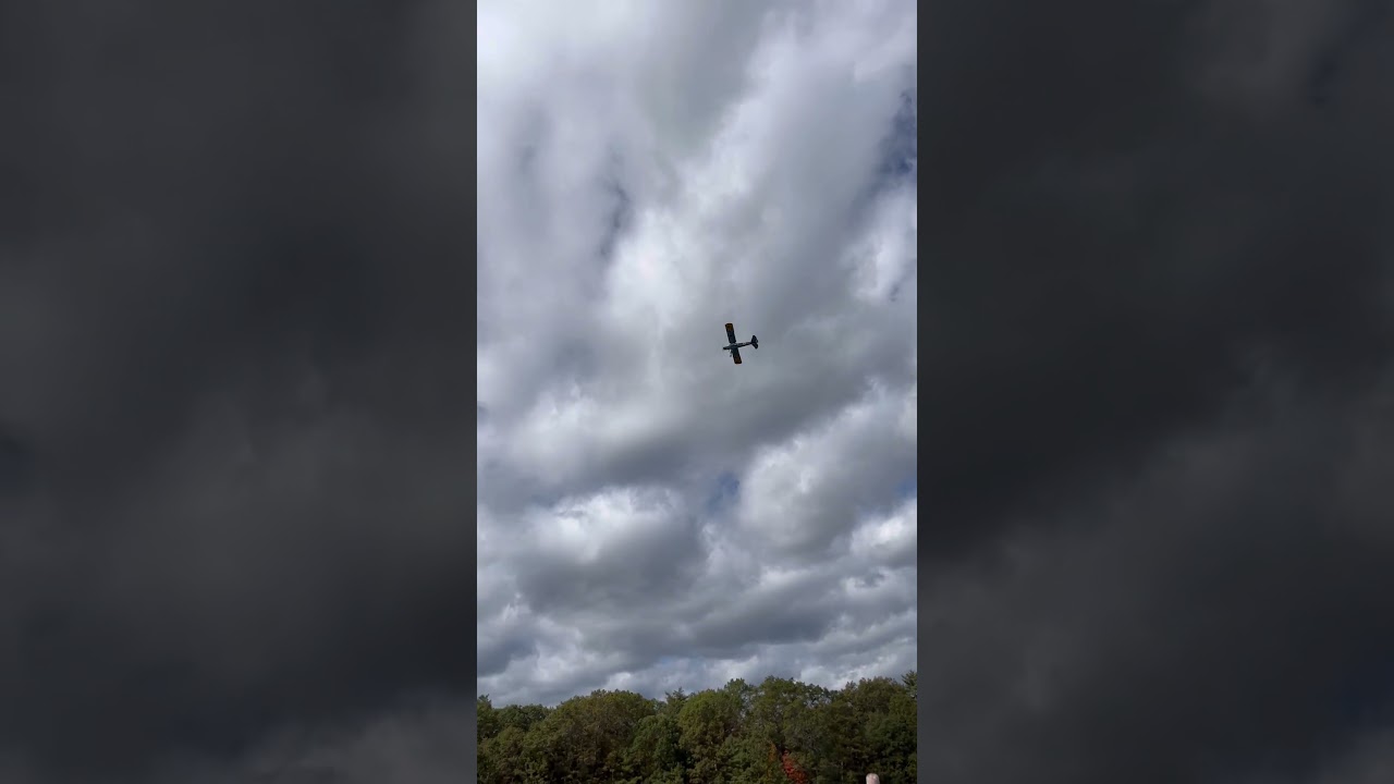 Ww2 German scout plane flying over parking lot