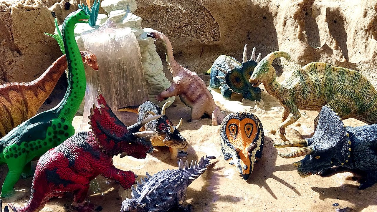Fun Toy Dinosaurs Diorama In The Sand