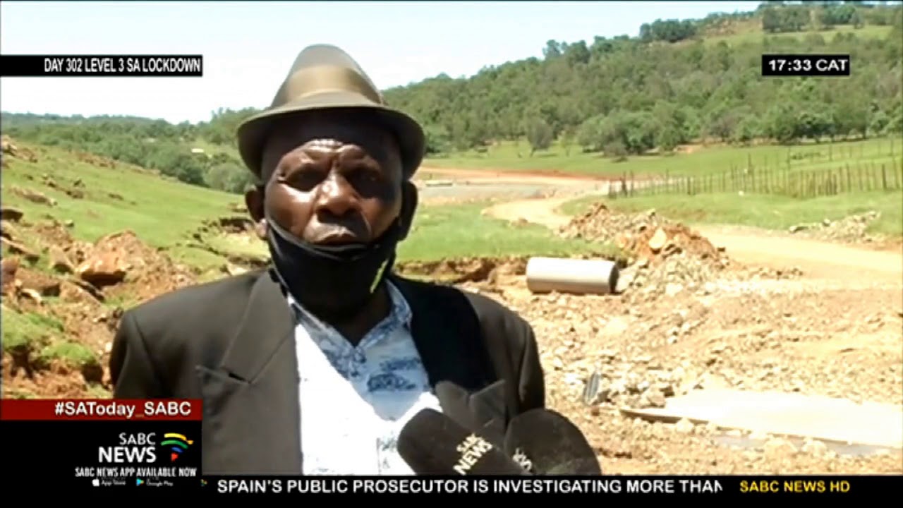 Women, children risk their lives daily crossing an overflowing river at Khayamandi village