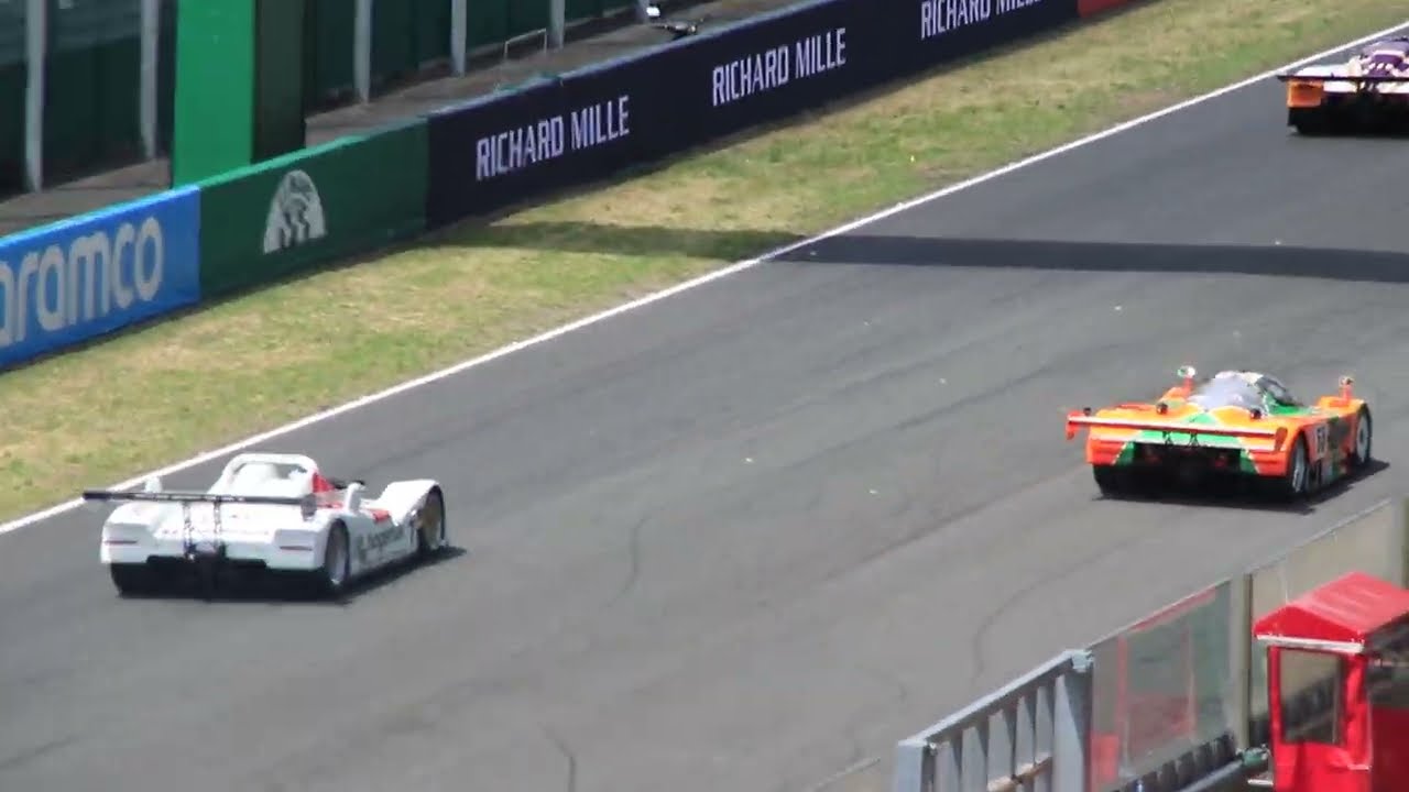 Le Mans Classic 2023 - the modern day winners line-up crossing the finish line.