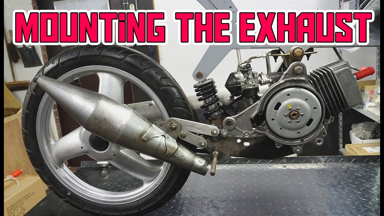 mounting the new exhaust on the Peugeot Fox Deluxe 50cc Racer
