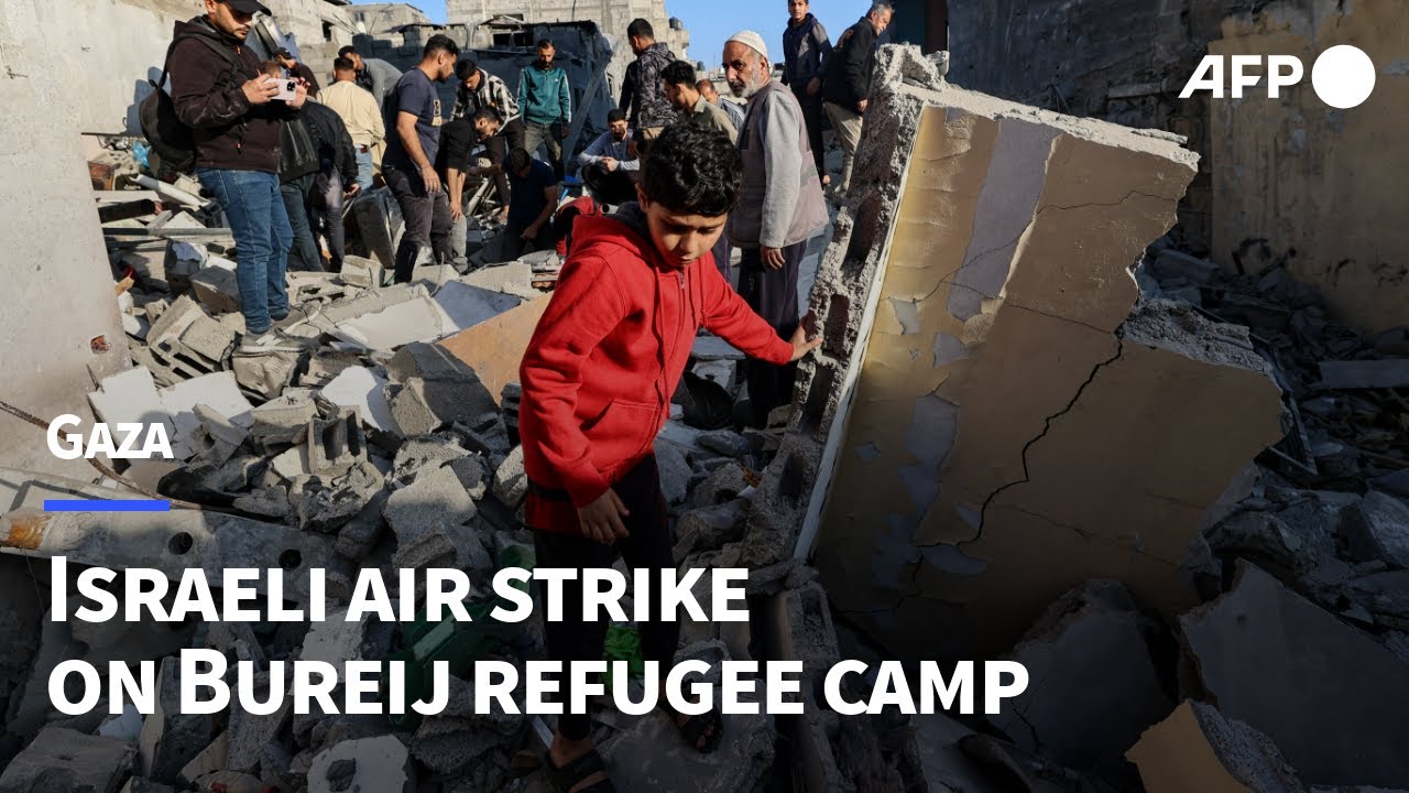 Gazans search for casualties following air strike on Bureij camp | AFP
