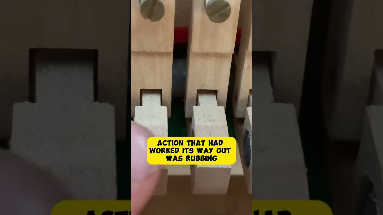 Fix a hanging damper while tuning a piano 