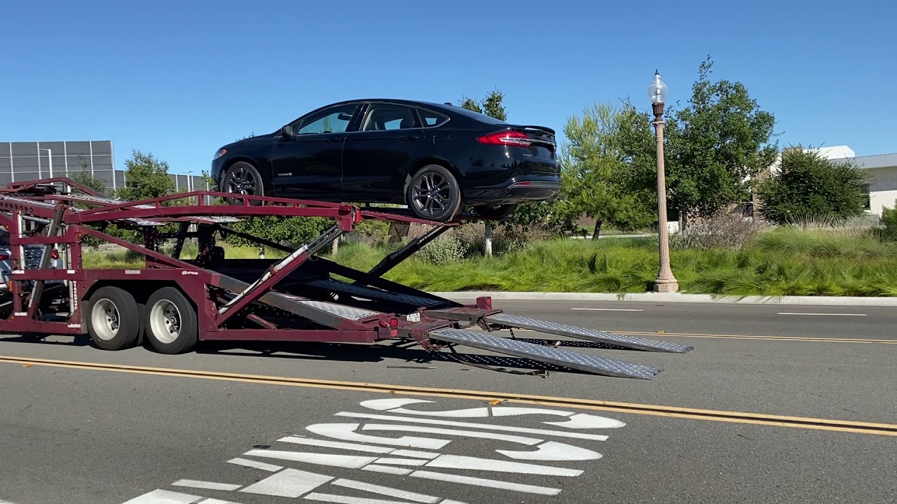 Loading Vehicles On Open Car Carrier Truck - ABC Auto Shipping