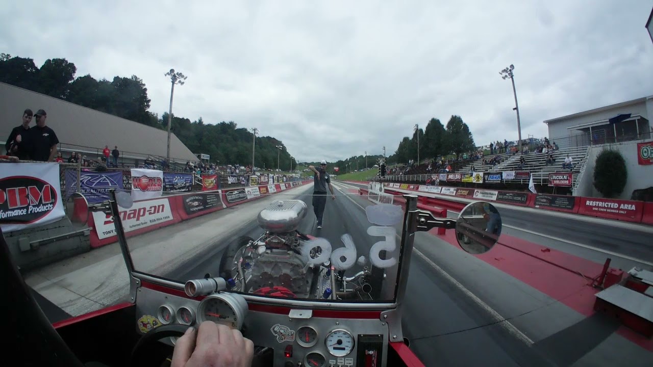 Blown Alky '23 T-bucket against a Slingshot