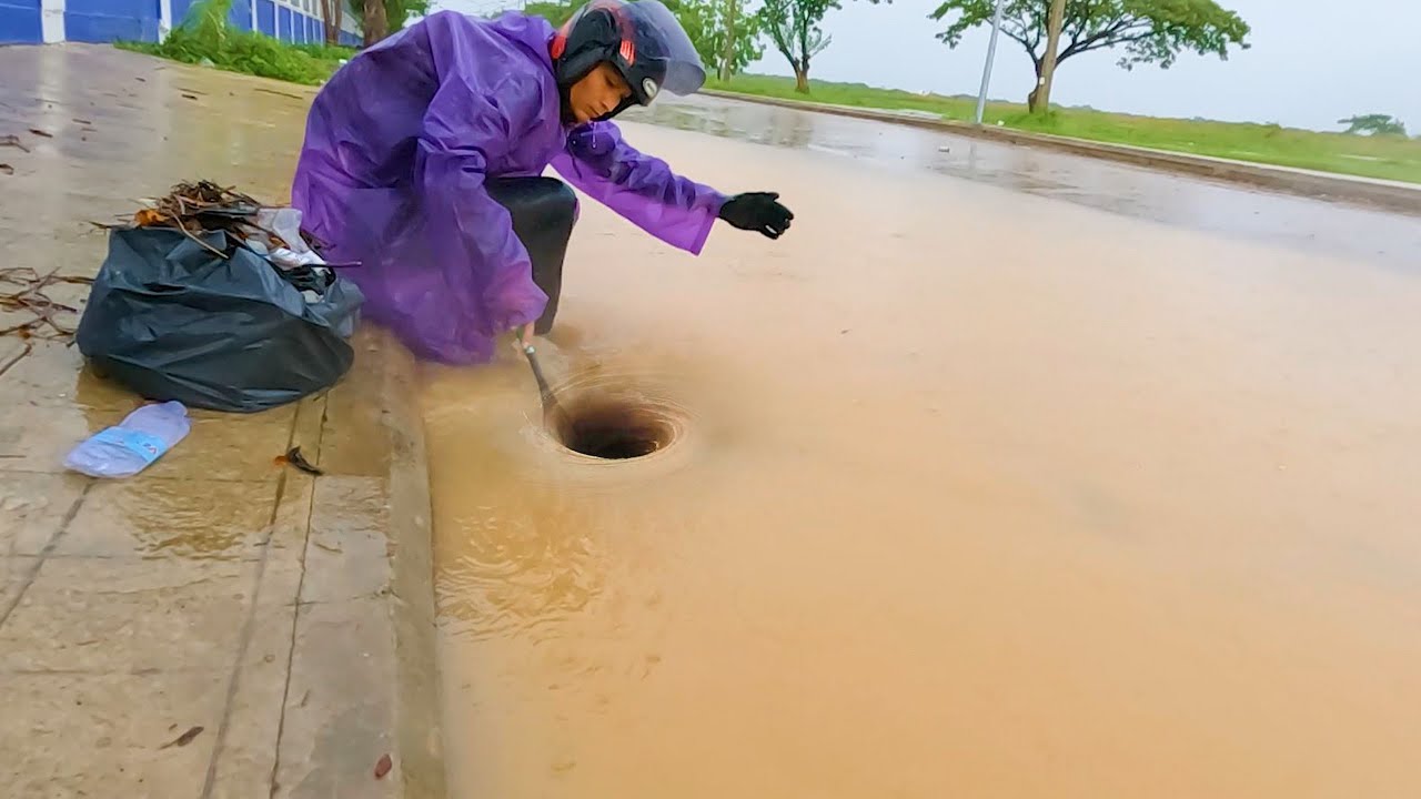 Draining a Flooded Street With Big Whirlpool While a Heavy Rain