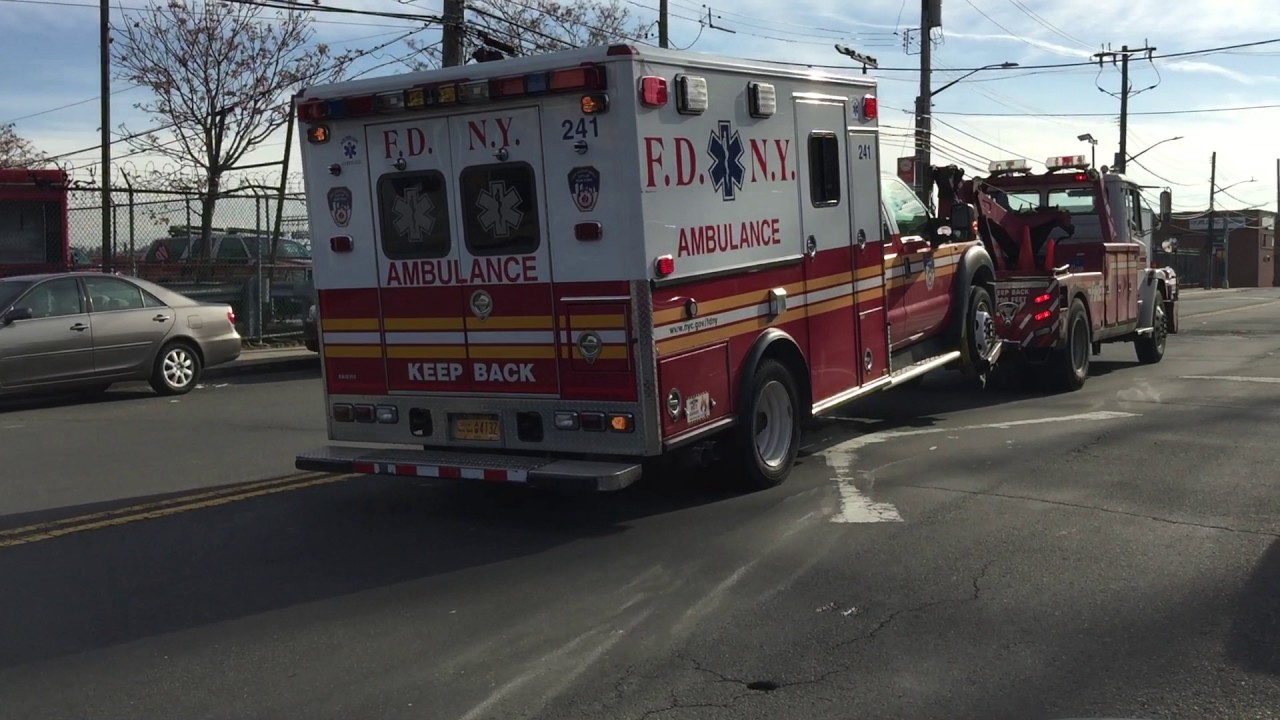 RARE CATCH OF ONE THE FDNY TOW TRUCKS TOWING A FDNY EMS IN MASPETH AREA OF QUEENS IN NEW YORK CITY.