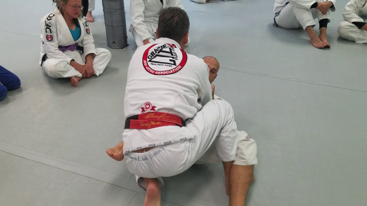Pedro Sauer showing knee shield pass at his affiliate school Urbana Academy