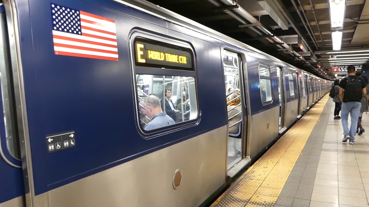 IND 8th Ave Line: R160A-2 E Train with a new MTA wrapped look at Canal St-Holland Tunnel