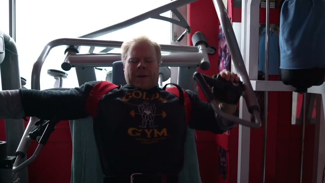 Michael Gundill, incline chest press machine with  Bowtie Posture Support