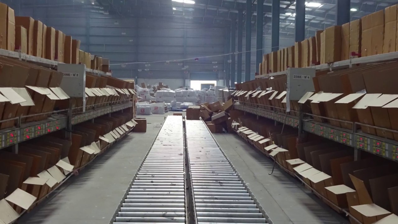 Put To Light Sortation System by Falcon Autotech for Store Order Fulfillment