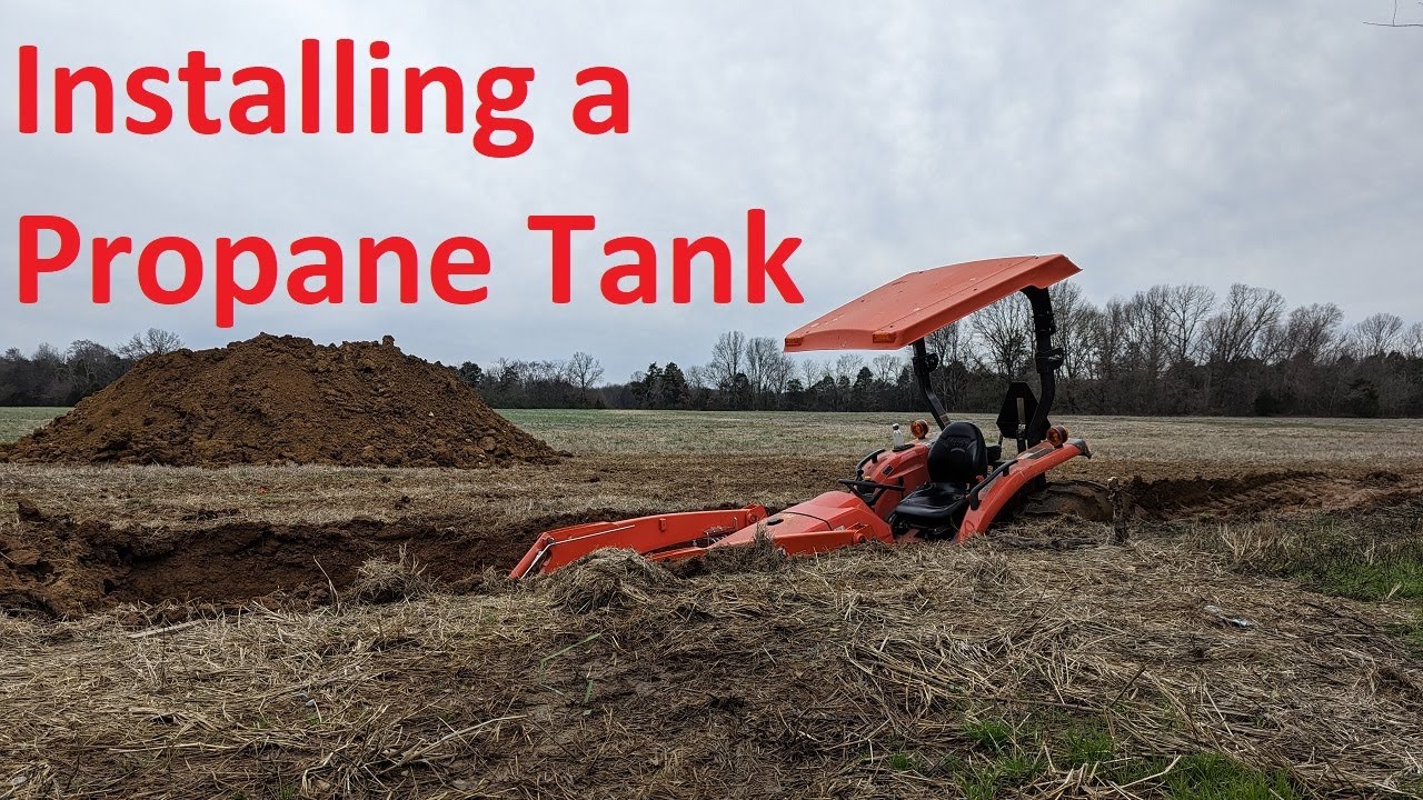 Digging a hole and installing a propane tank with my tractor - Eric Outdoors 001