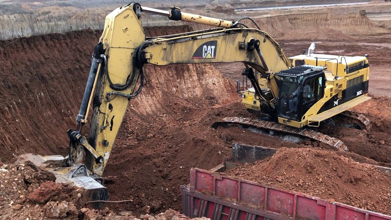 Caterpillar 365C Excavator Loading Trucks