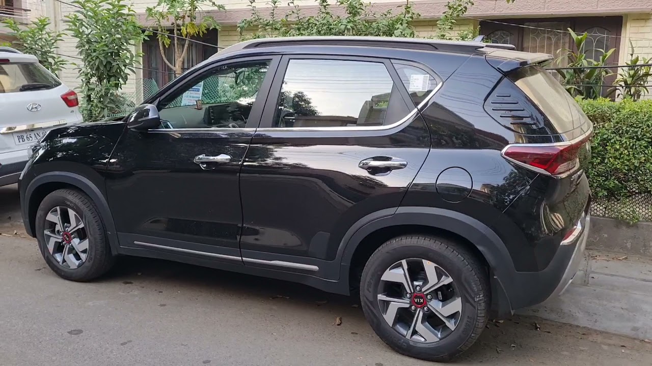 #kia #sonet #black #modified #bonnet chrome #rear spoiler #tail light and trunk chrome