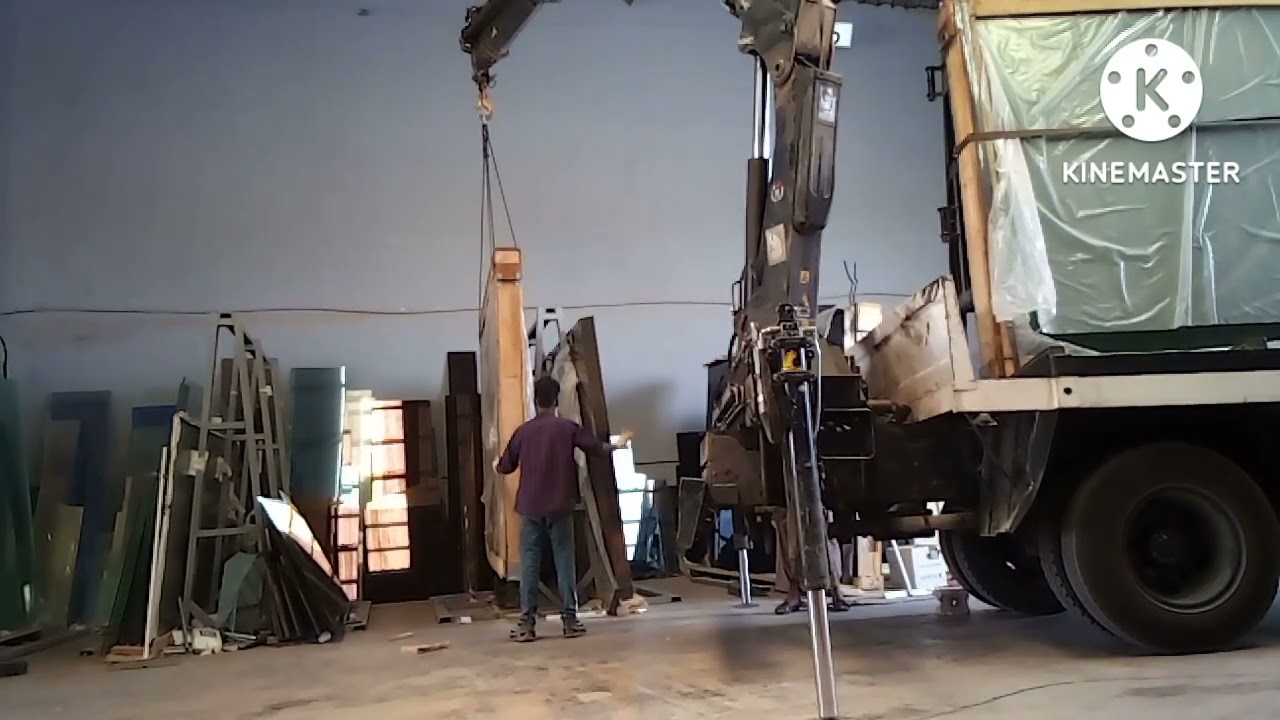 Float glass crate unloading by overhead crane.