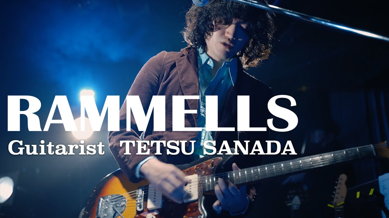 TETSU SANADA plays the guitar