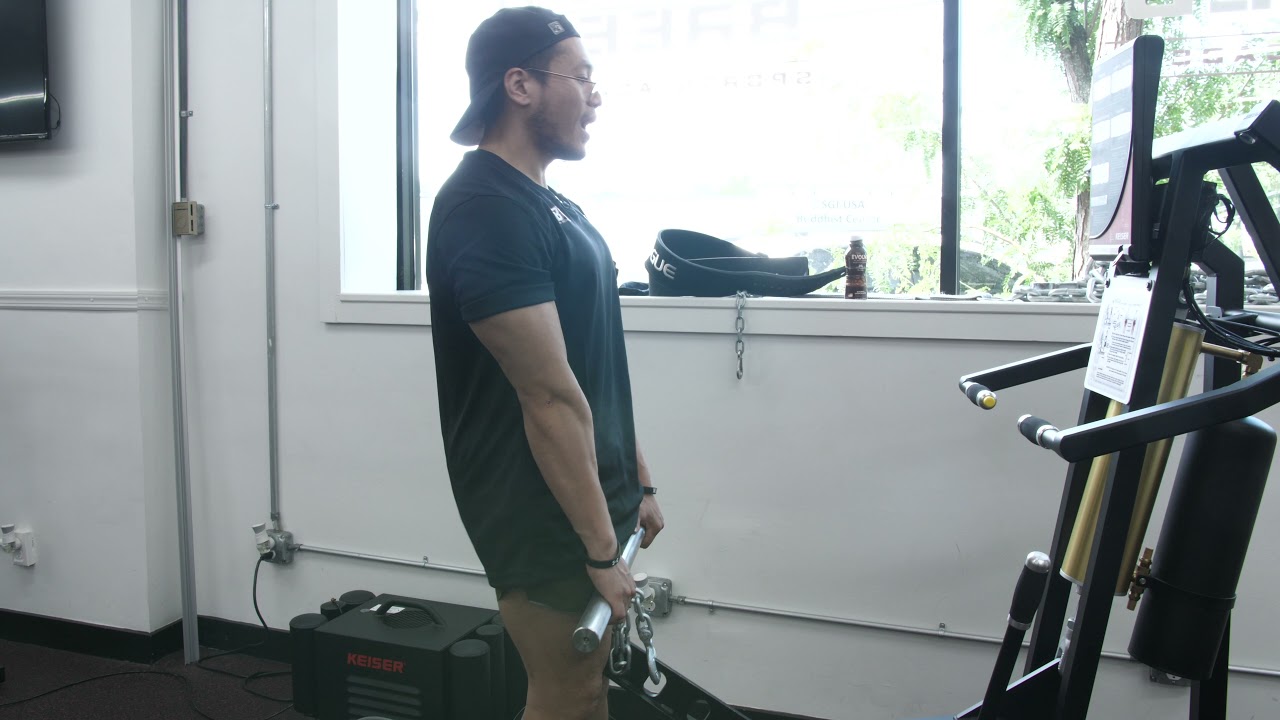 Coach Mike demoing deadlifts on the Keiser Functional Trainer 3020 at Different Breed Sports Academy