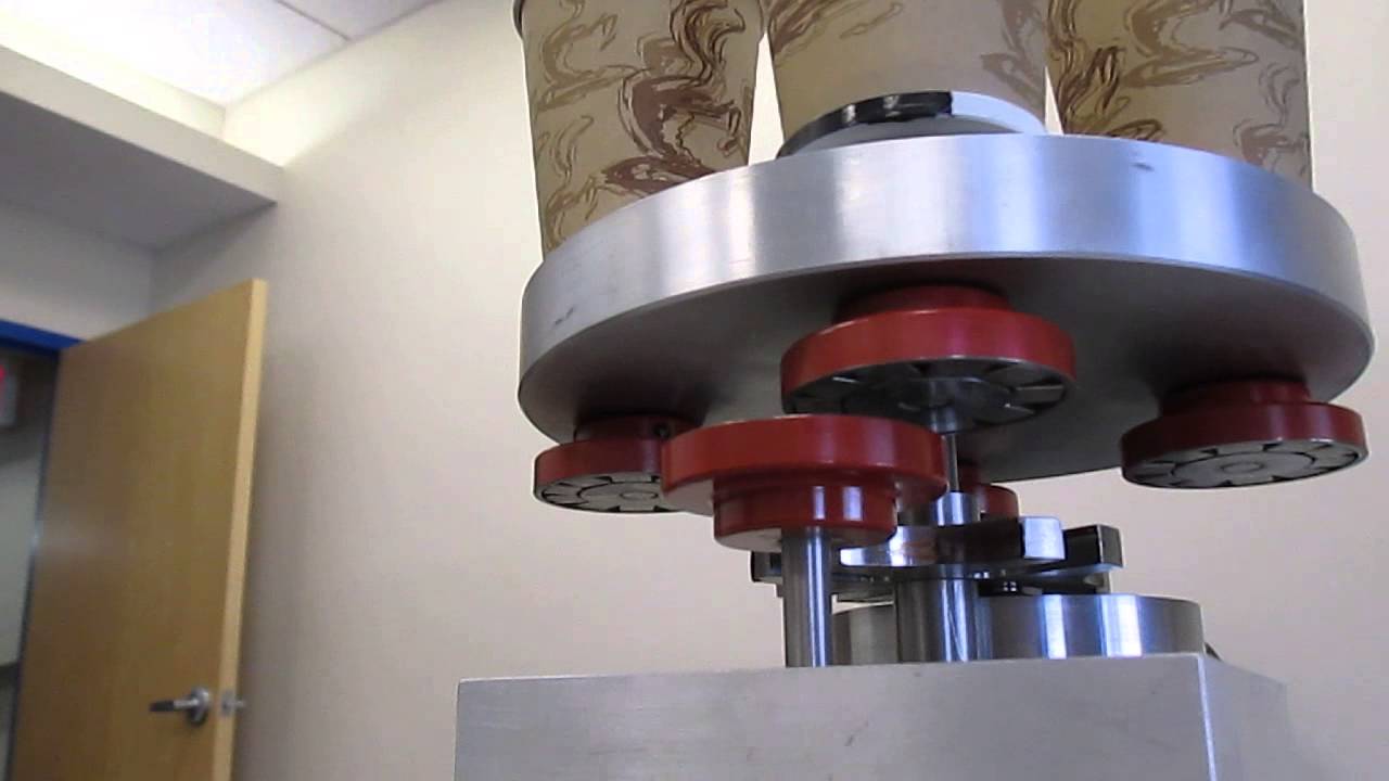 ROTARY INDEXING TABLE WITH MAGNETIC DISC COUPLING