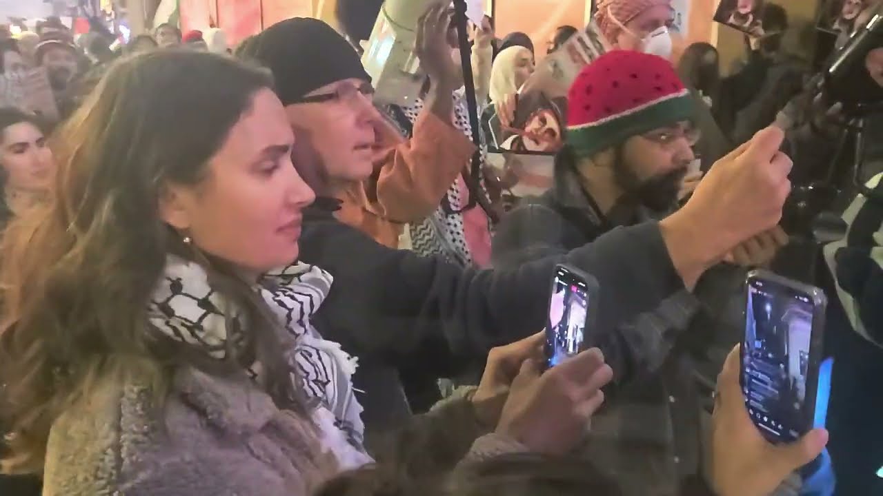 Palestinian protester addresses the crowd as the protest Michael Rappaport's comedy show.