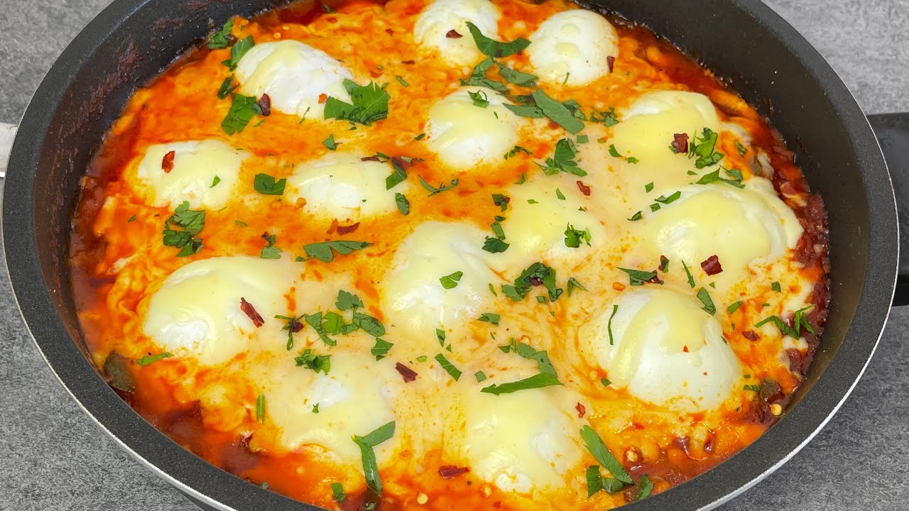 boiled eggs with tomato sauce and cheese