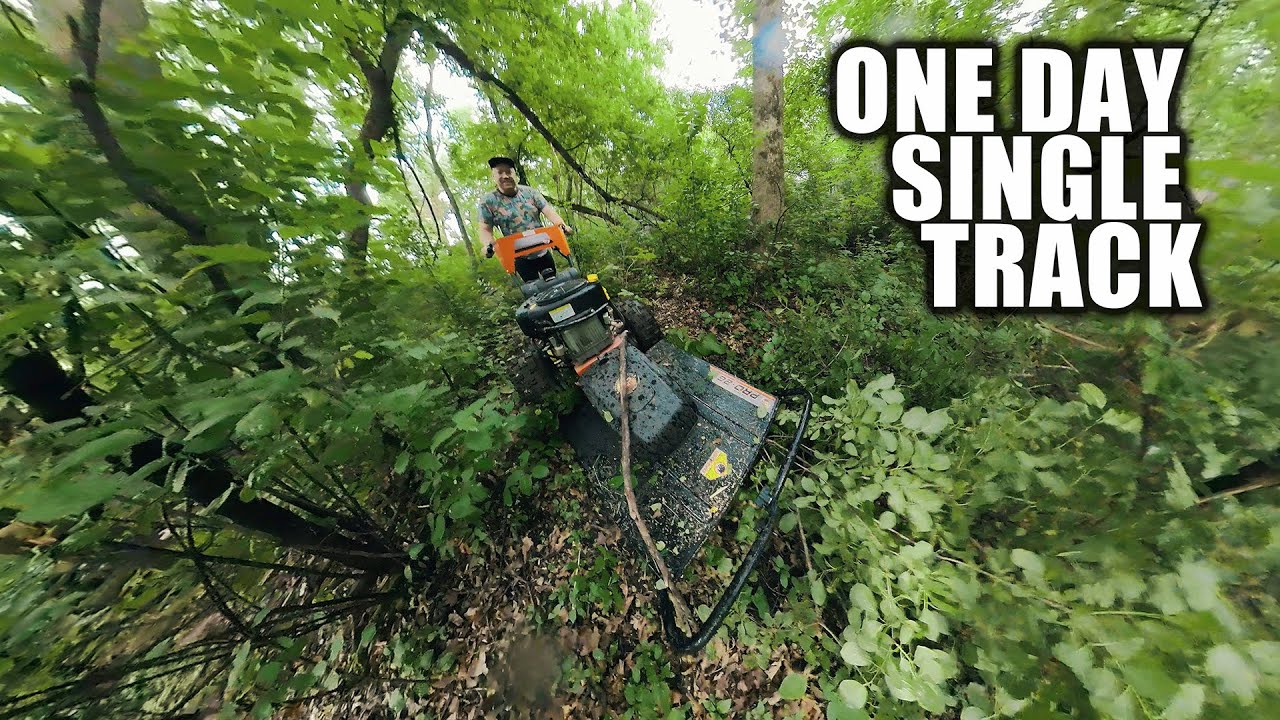 Cutting a dirt bike single track trail in the woods with the brush hog