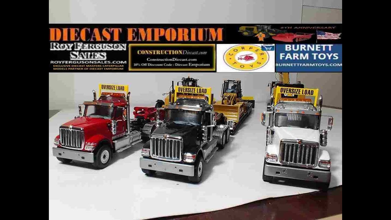 Diecast Masters International HX520 Tandem Day Cab Tractors With Lowboys w/Caterpillar Machines