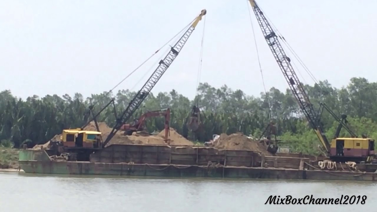 Old P & H Cranes Unloading Sand From A Barge