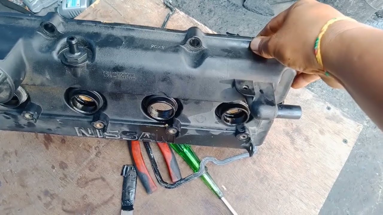 NISSAN XTRAIL SPARK PLUG SEAL OIL LEAK