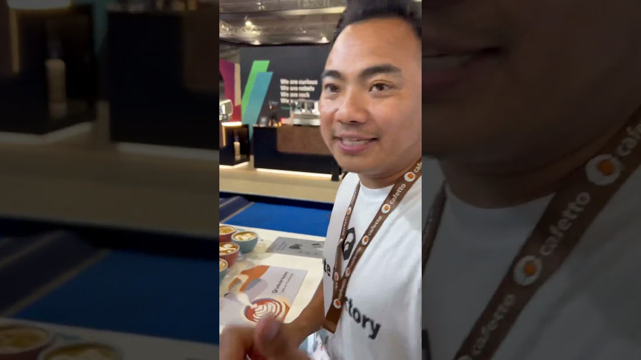 Dhan Tamang, six times UK Latte Art champion demos the Latte Art Factory at World of Coffee, Athens