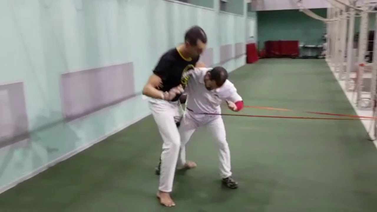 Capoeira drills with a resistance band